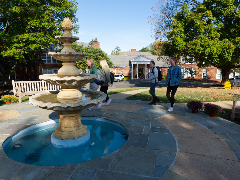Students walking past the fountain on the MVC Quad
