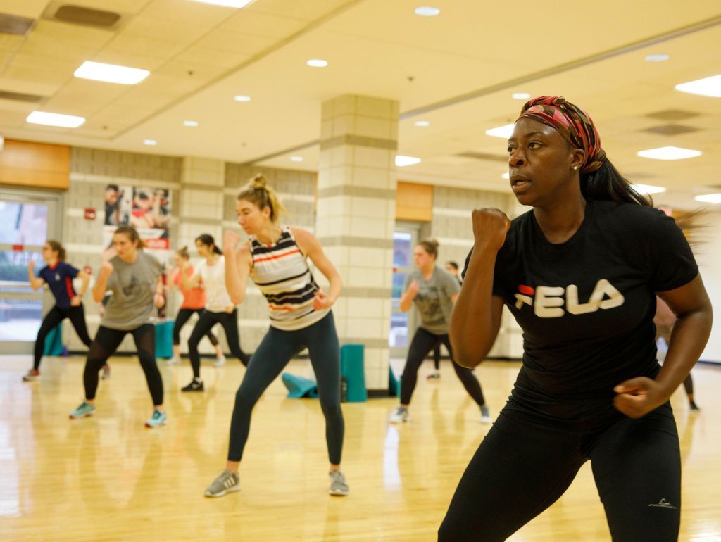 People participating in a group fitness class