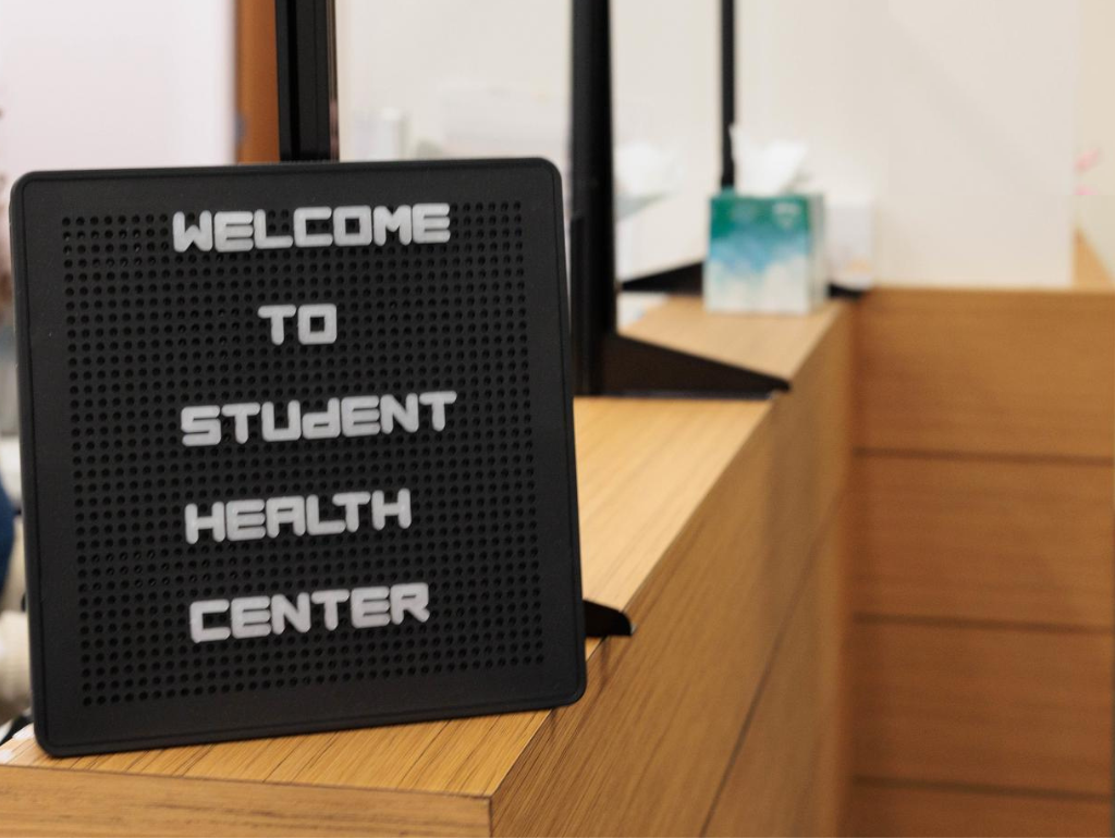 A welcome sign at the front desk of the Student Health Center