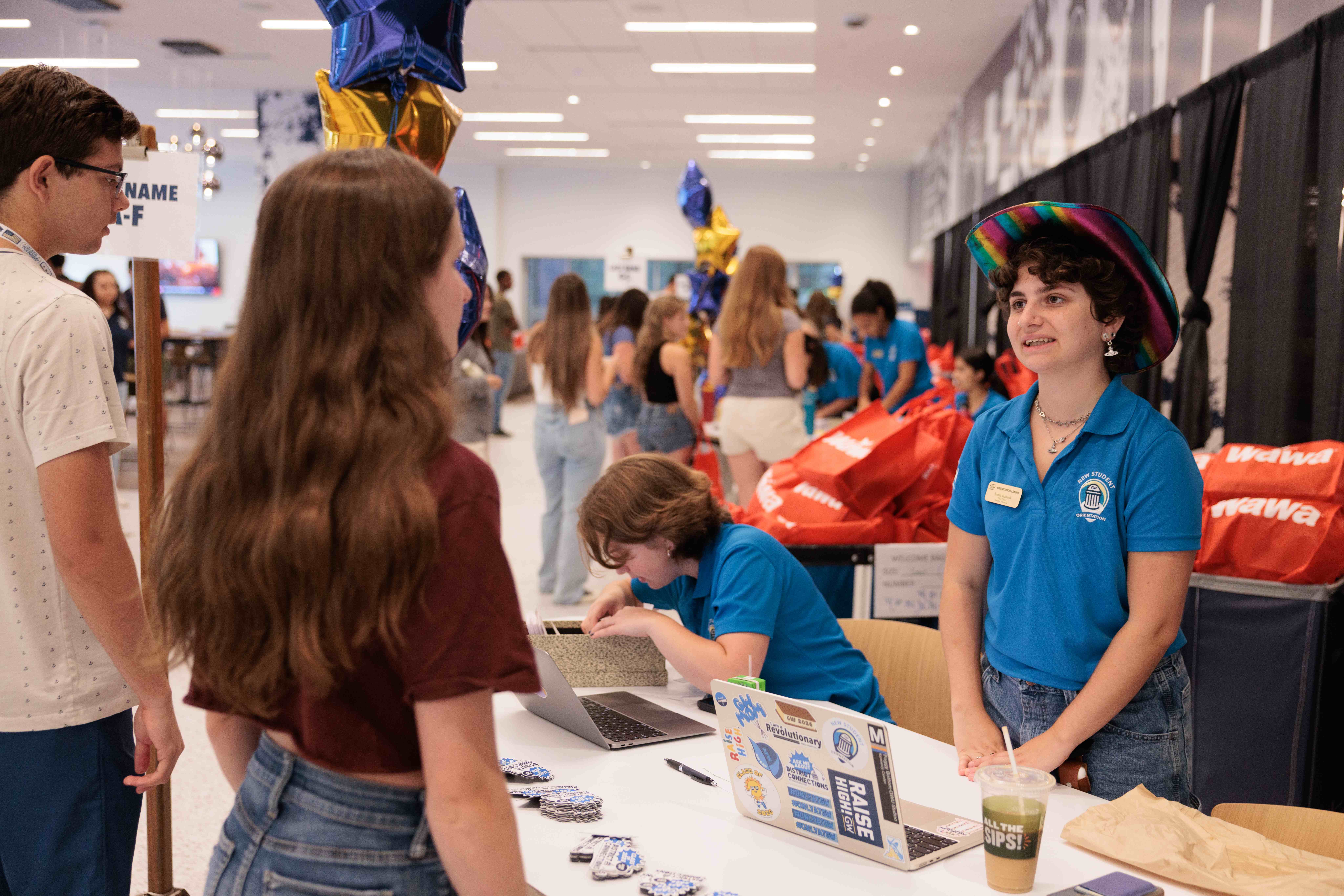 A new GW student checks in for New Student Orientation in the University Student Center