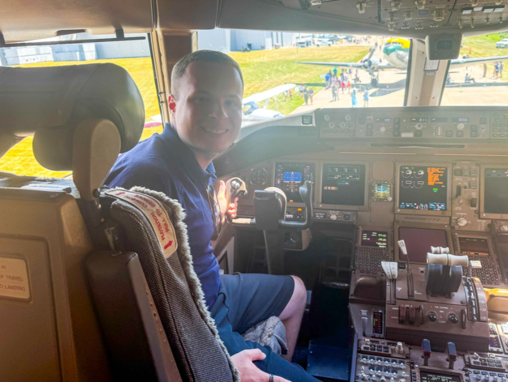 GW graduating senior Demetrius Apostolis sits in a United 777 flight deck