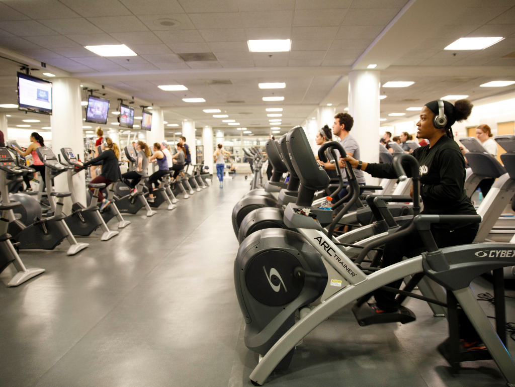 Students working on of fitness equipment in the Lerner cardio room