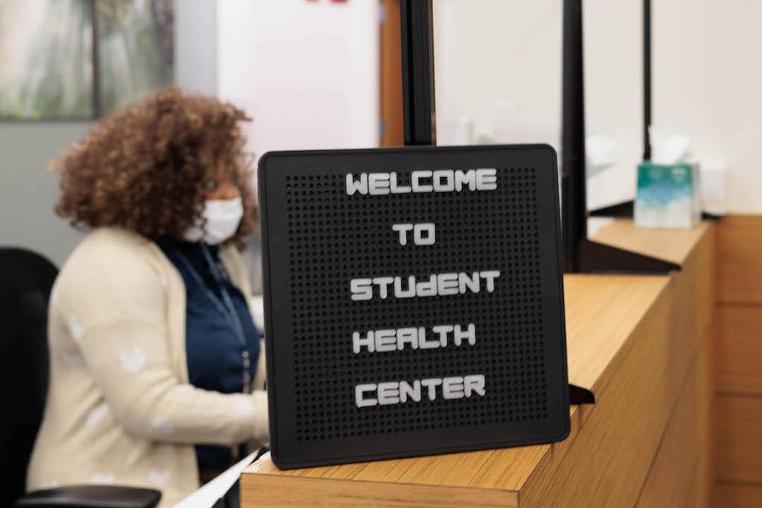 A welcome sign at the front desk of the Student Health Center