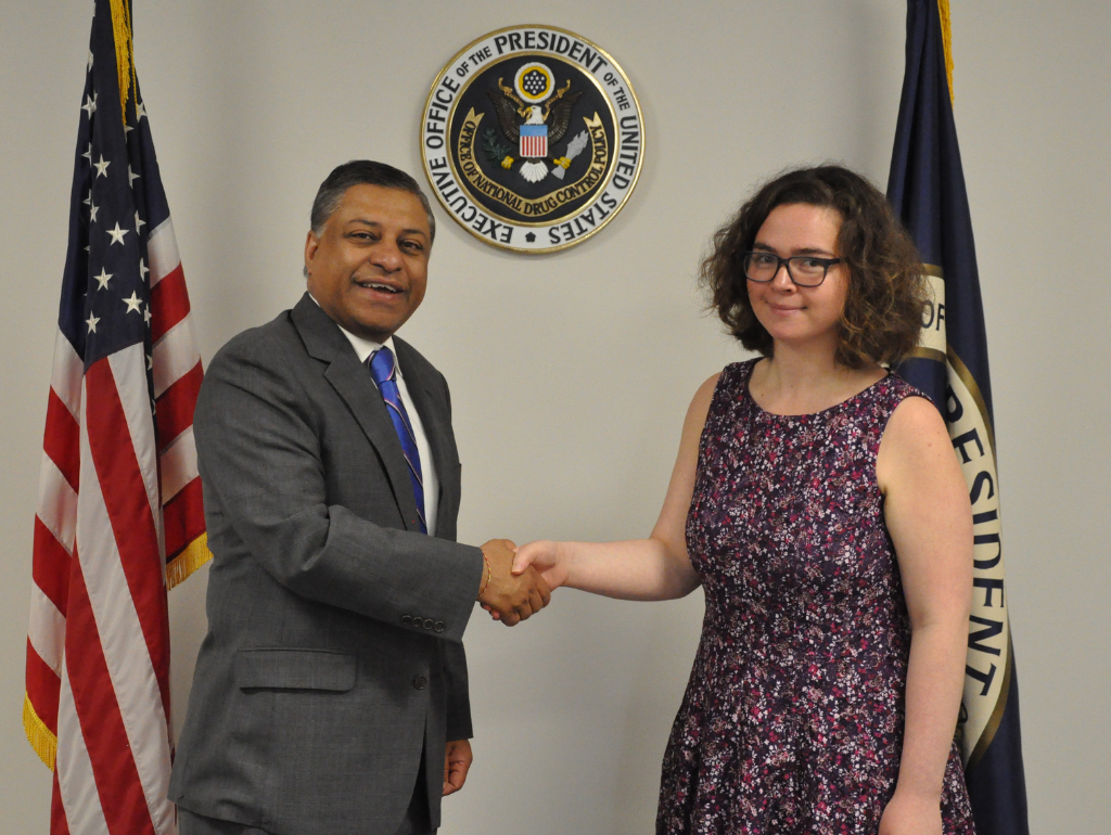 Alanna Moskowitz shaking hands with Director of the Office of National Drug Control Policy Rahul Gupta