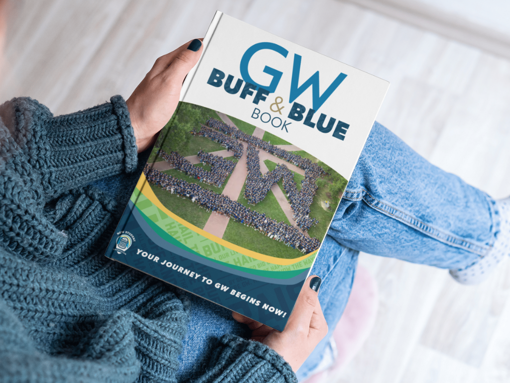 Student holding a copy of a Buff and Blue Book