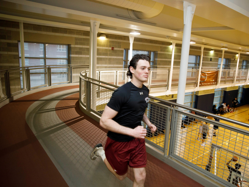 Student running on the suspended track lanes in Lerner