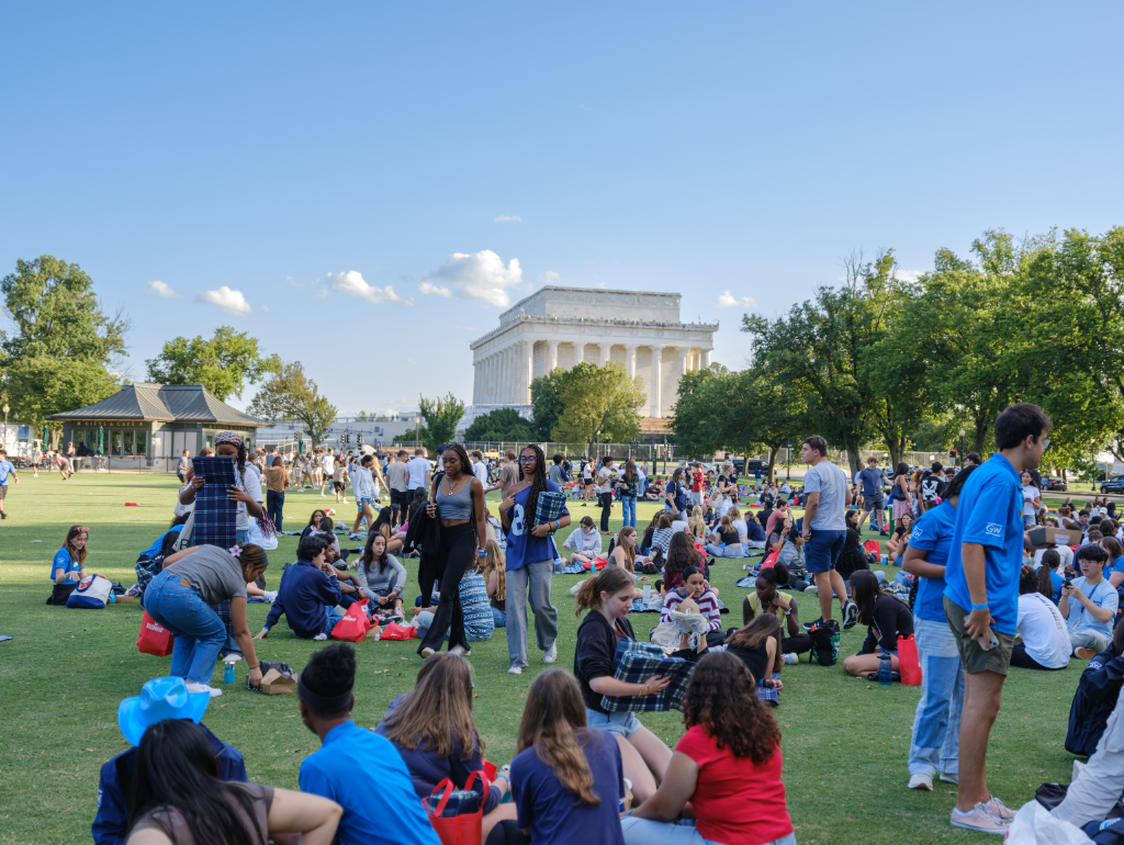 Large crowd of first-year students on the National Mall for NSO, the Lincoln Memorial in the background
