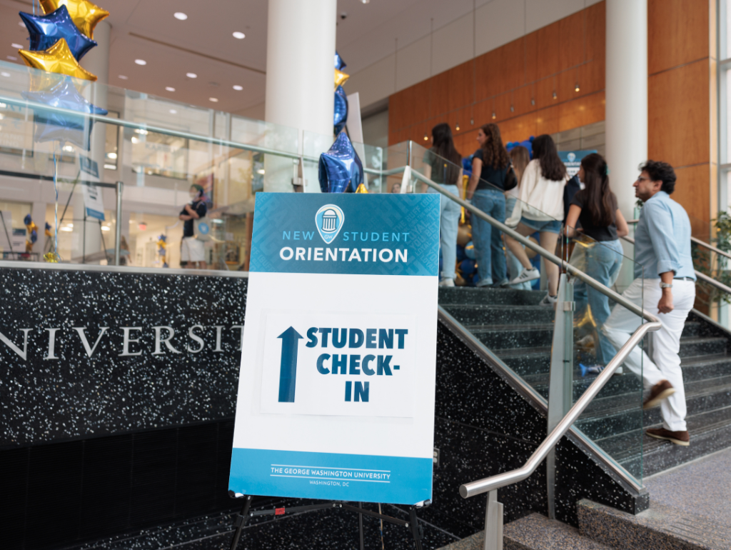 Sign reading "Student Check-In" outside the USC Great Hall for Orientation