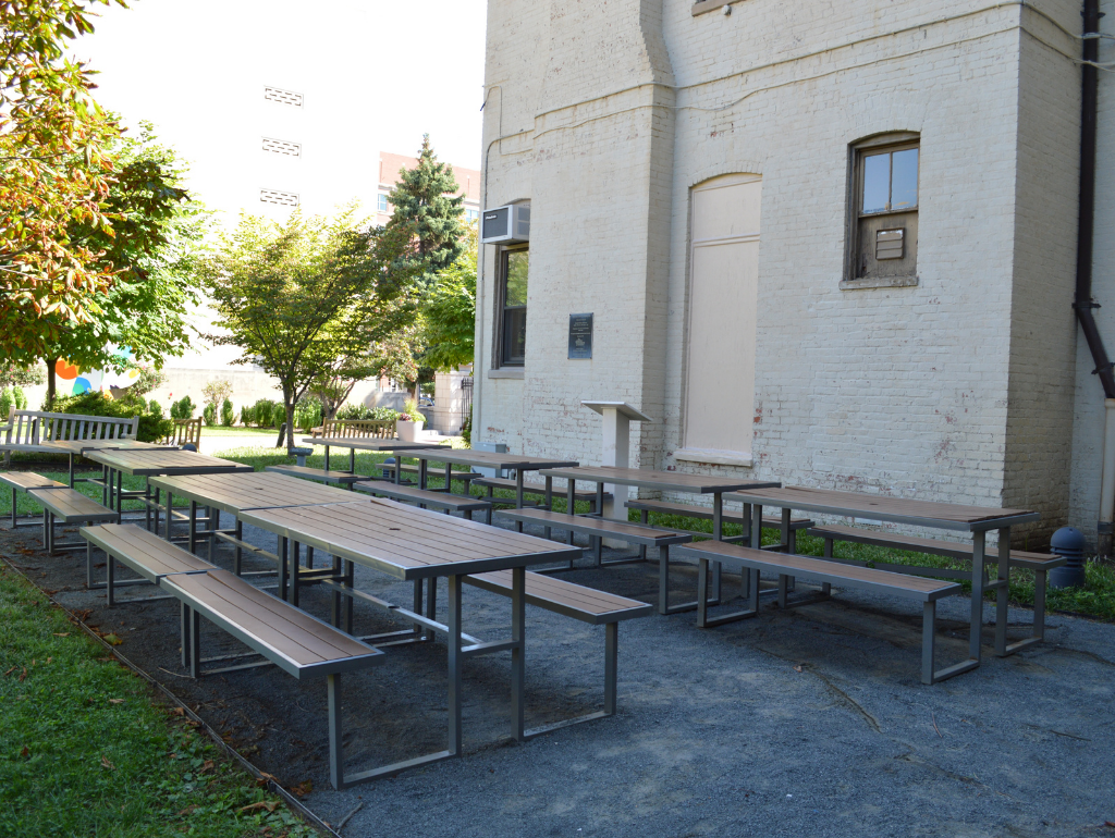 Tables and benches set up outside for classroom use