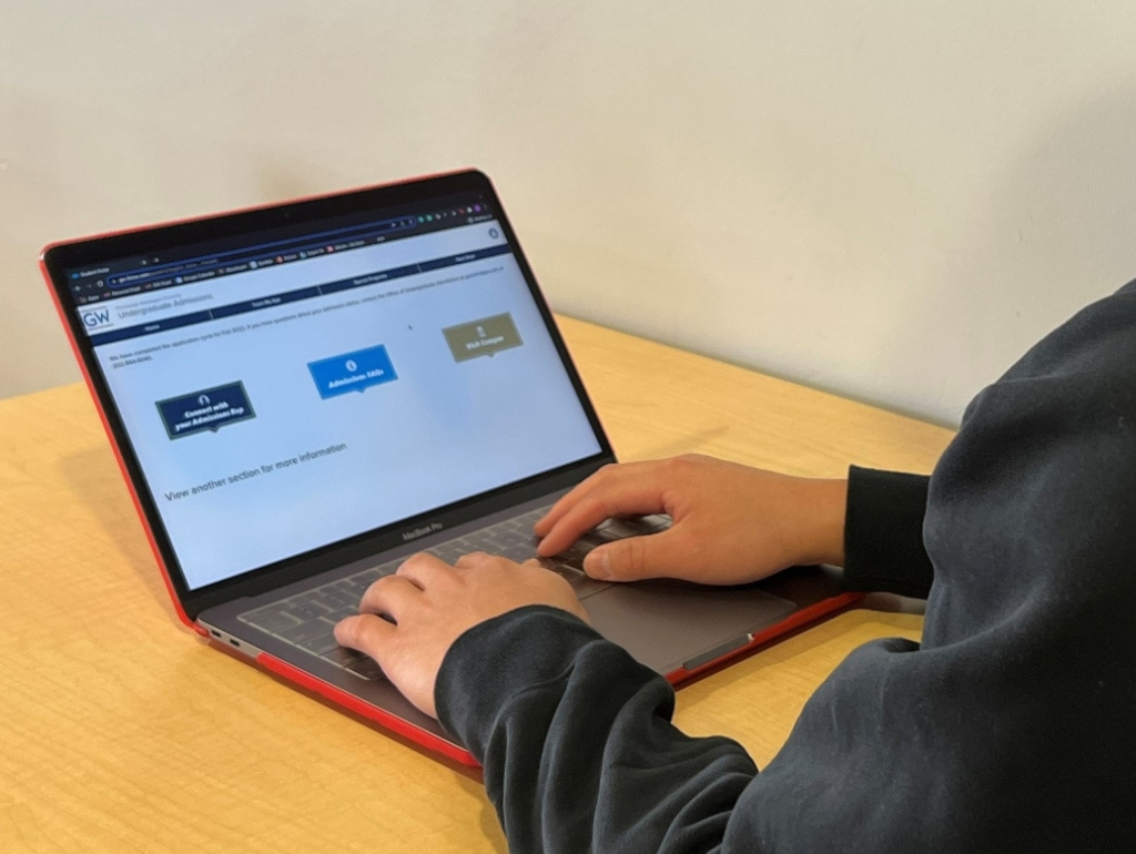STudent on a laptop viewing the Orientation module website