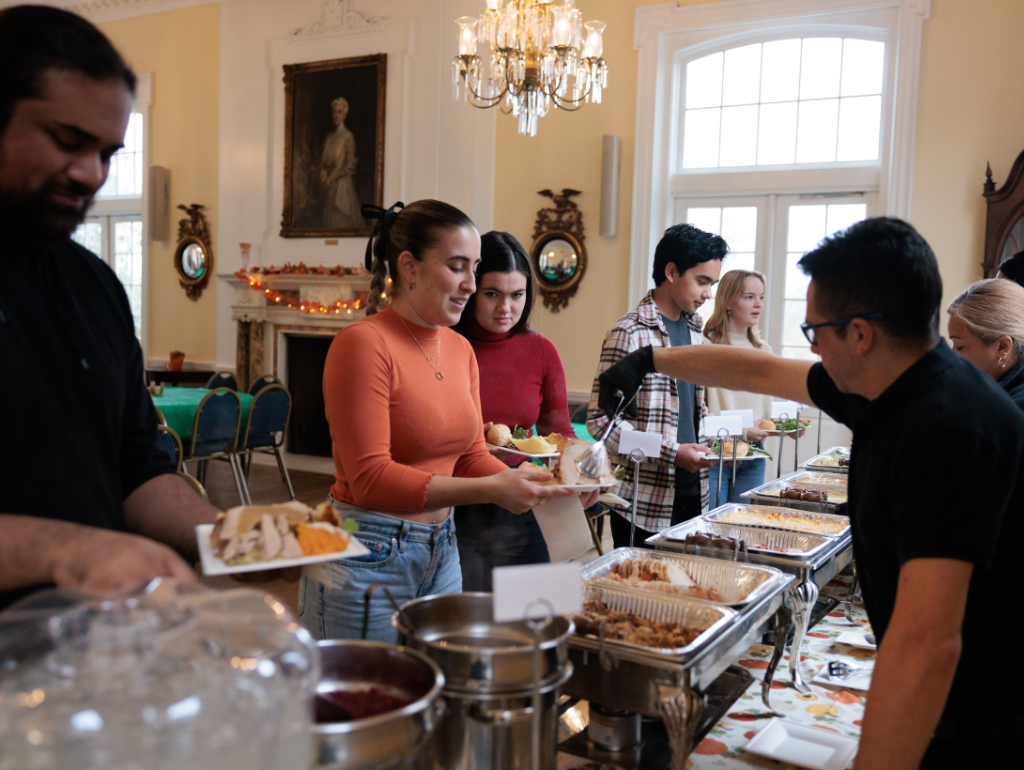Students being served dinner in Post Hall for Thanksgiving